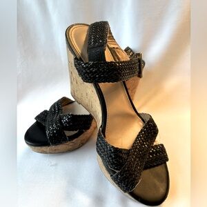 Black woven leather sanity a wedge cork heel by Arturo Chiang